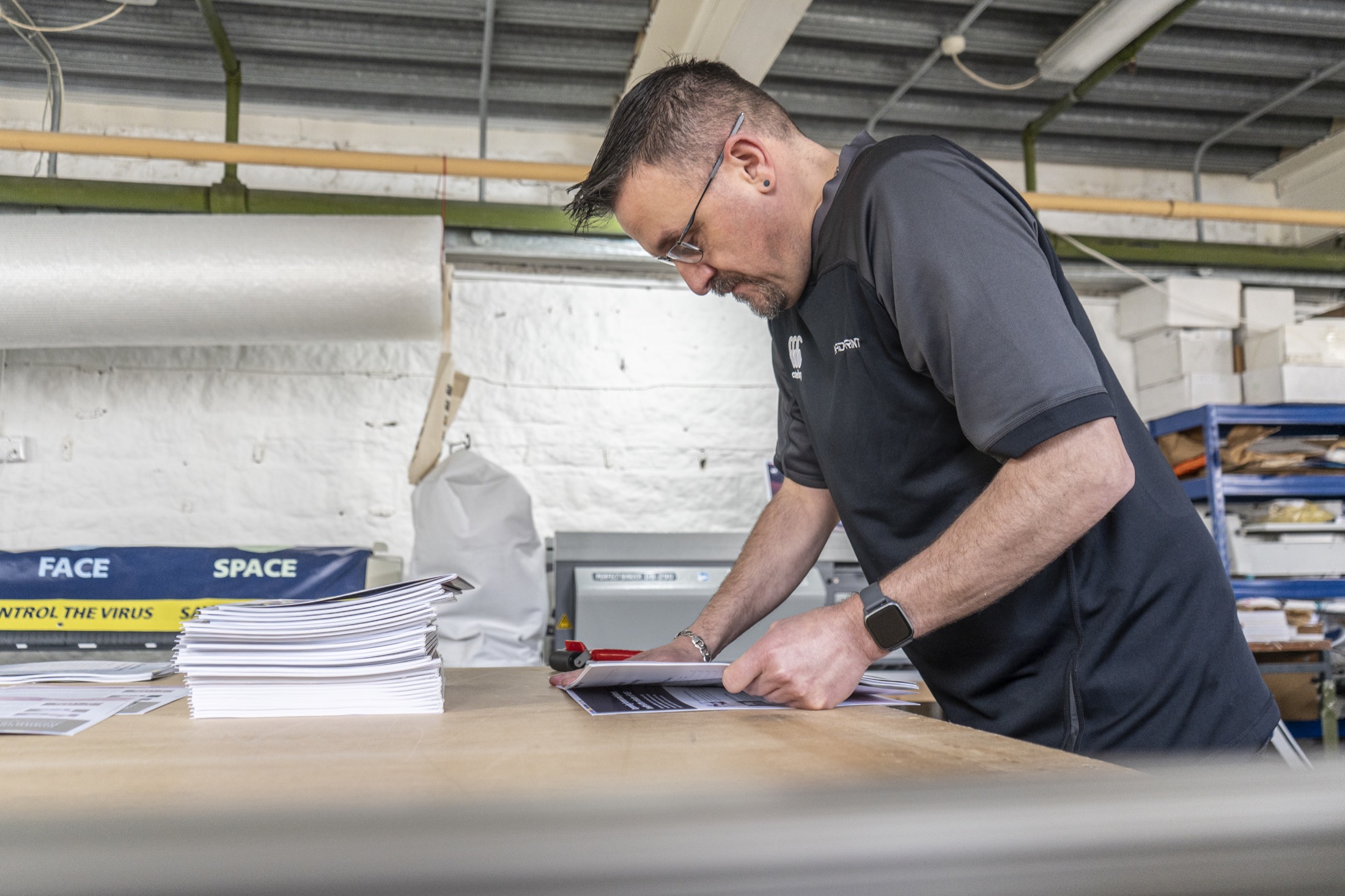 HAD-PRINT team member hand-finishing a print project
